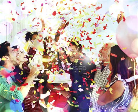 Family throwing confetti celebrating birthday party with cake — girlfriend, wife - Stock Photo ...