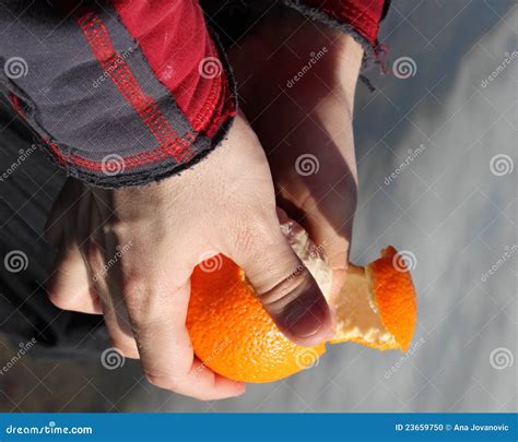 Peeling An Orange Stock Photo - Image: 23659750