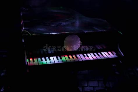 Piano on a Dark Background in the Light of Lamps. Close-up. Background ...