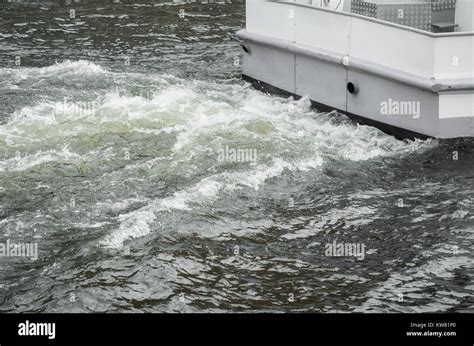 Waves behind a moving boat Stock Photo - Alamy