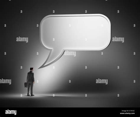 Business communication concept - man with a speech bubble Stock Photo - Alamy