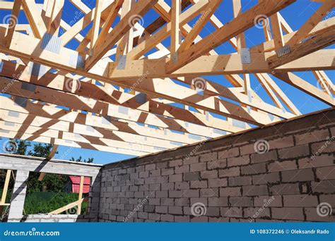 House Roofing Construction with Wooden Trusses. Timber Roof Trusses ...