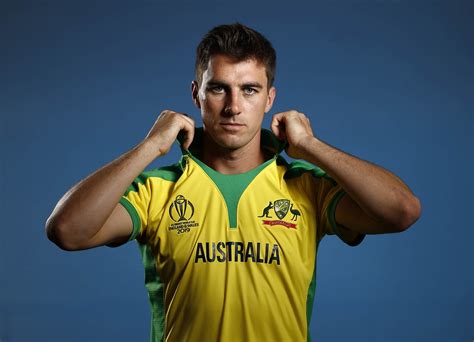 Pat Cummins poses during a photo session | ESPNcricinfo.com