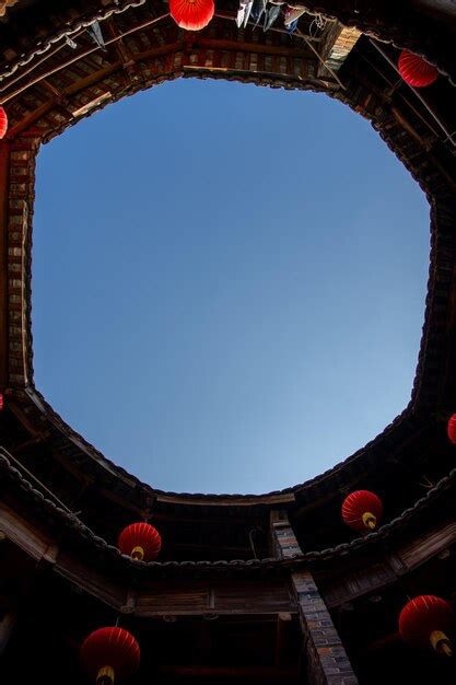 Premium Photo | The sky above the round buildings of hekeng tulou cluster in the early morning ...