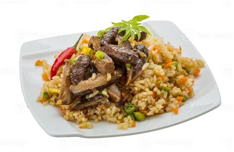 Fried rice with mushrooms 8432537 Stock Photo at Vecteezy