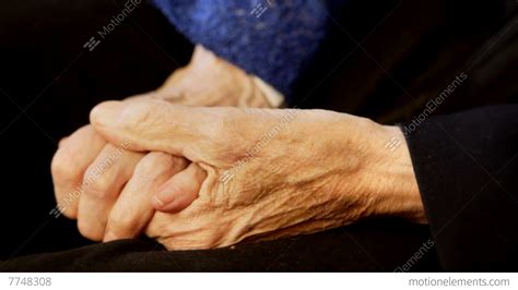 Old Couple Holding Hands Stock video footage | 7748308