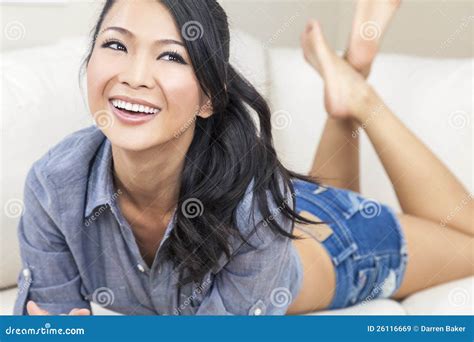 Beautiful Chinese Oriental Asian Woman Smiling Stock Image - Image of cheerful, laying: 26116669