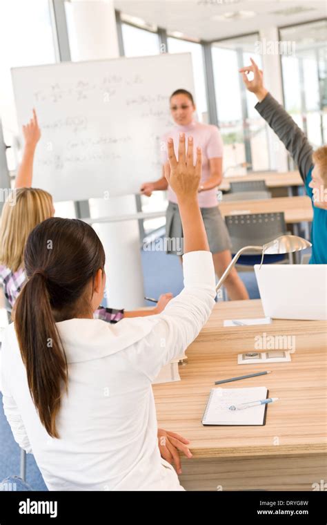 High school students raising hands Stock Photo: 66373689 - Alamy