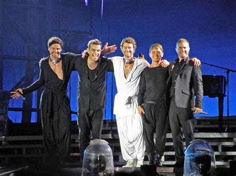 Take That tease a big reunion with Robbie Williams