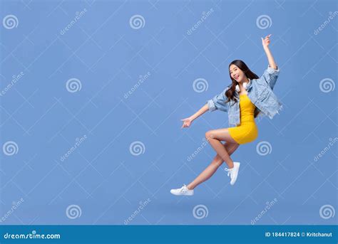 Young Beautiful Smiling Asian Girl Floating in Mid-air Stock Photo - Image of copy, midair ...