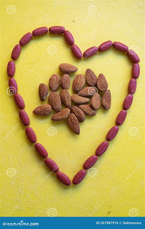 Almonds and heart health stock photo. Image of heart - 267987916