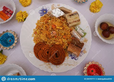 Garnished Diwali Faral or Namkin and Sweets in White Plate Stock Image ...