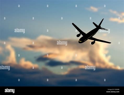 Passenger jet airplane silhouette in blurred sunset sky. Vector ...