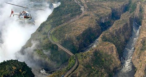 Helicopter flight over the Victoria falls. | Helicopter tour, Victoria falls, Africa tour