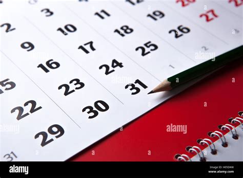 calendar and pencil close-up Stock Photo - Alamy