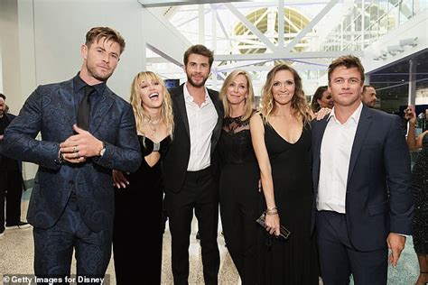 Miley Cyrus poses alongside Liam Hemsworth and his brothers Chris and Luke in rare family ...