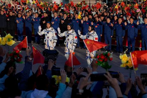 China sends its youngest-ever crew to space as it…