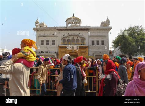 Queue of devotees along with Akal Takht inside the Golden Temple in Amritsar in India. This was ...