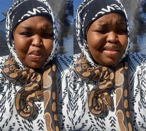 Gogo Maweni shows off one of her well behaved snakes - Mbare Times