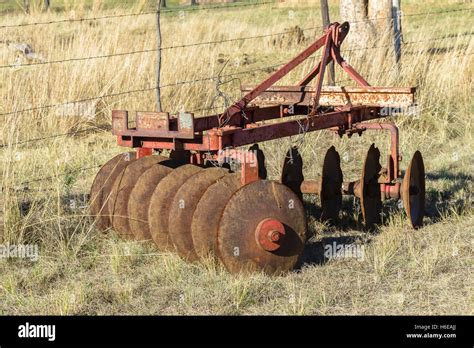 Farming old mechanical tractor vintage earth plows Stock Photo - Alamy