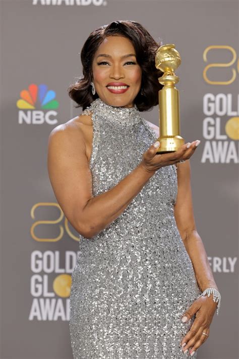 Golden Globes fans lust after Angela Bassett, 64, and say she looks half her age as she accepts ...