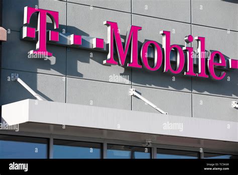 A logo sign outside of a T-Mobile retail store location in Martinsburg, West Virginia on June 4 ...