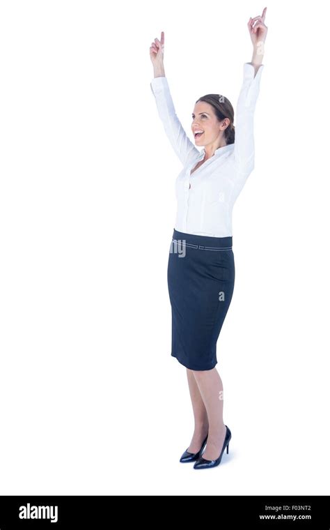 Businesswoman doing a victory pose Stock Photo - Alamy