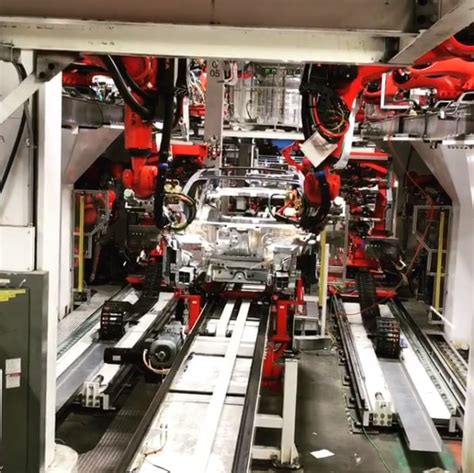 Watch: Tesla Model 3 Assembly Line Robots Working Hard Towards 5000 ...