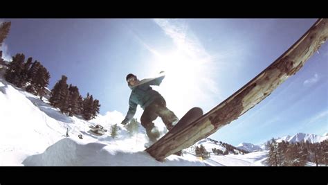 SLOW MOTION: Snowboard Girl Spraying Snow Into Camera Stock Footage ...