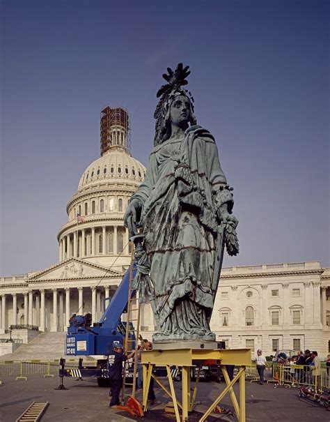 the statue is being worked on in front of the capitol building