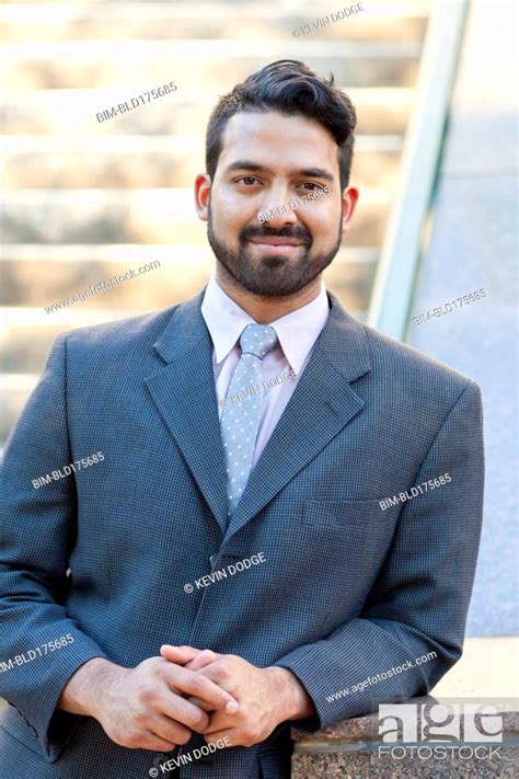 Indian businessman smiling outdoors, Stock Photo, Picture And Royalty ...