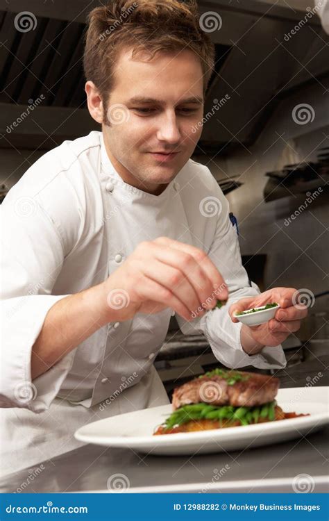 Chef Adding Seasoning To Dish in Restaurant Stock Photo - Image of sauce, male: 12988282