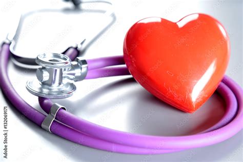 Red heart and a stethoscope on white background Stock Photo | Adobe Stock