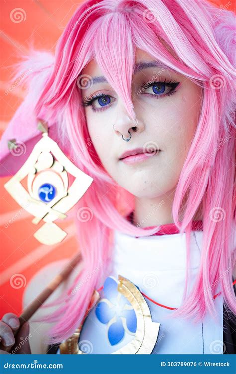 Female Cosplayer in a Pink Anime Costume Wearing Pink Hair Stock Photo - Image of triumph, proud ...