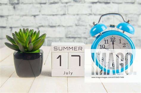 July 17 on the wooden calendar.The seventeenth day of the summer month, a calendar for the