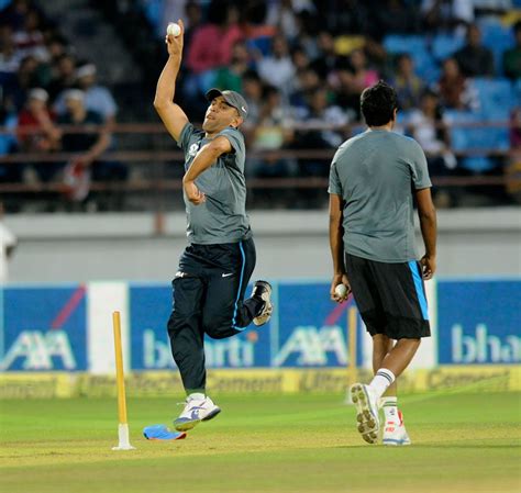 MS Dhoni has a bowl as he unwinds during practice | ESPNcricinfo.com