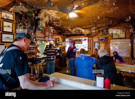 Visitors dining inside the Swiftwater Seafood Cafe, Whittier, Alaska ...