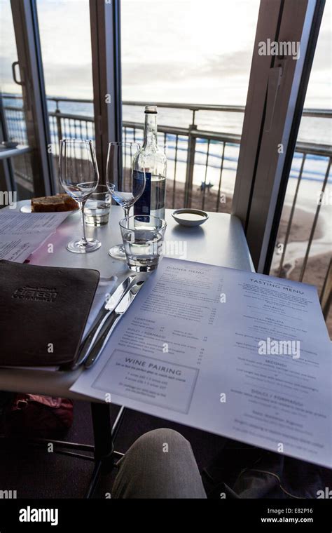 Fifteen Jamie Oliver's menu restaurant inside table set drinks sea view ...