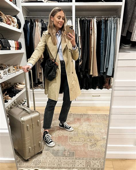 travel outfit, trench coat outfit, trench coat and jeans outfit, black ...