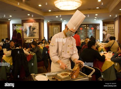 Chef prepares Peking duck in Quanjude Roast Duck restaurant Wangfujing Street Beijing China ...