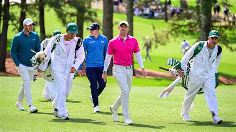 Brooks Koepka, Rory McIlroy of Northern Ireland, and Matthew Fitzpatrick of England on the No. 3 ...