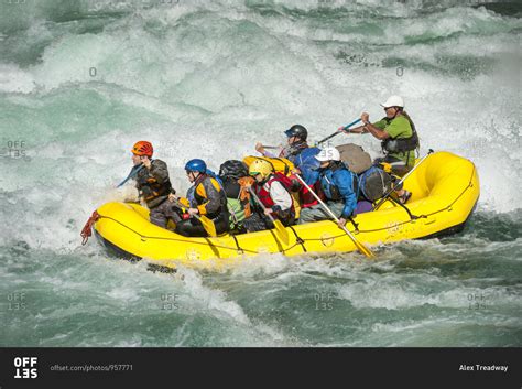 Rafting through white water rapids on the Karnali river in west Nepal stock photo - OFFSET