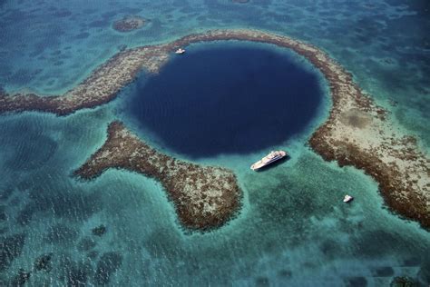 The Great Blue Hole is a giant marine sinkhole off the coast of Belize ...