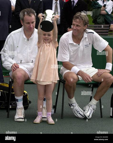 John McEnroe's daughter, four year old Anna McEnroe, holds her father's ...