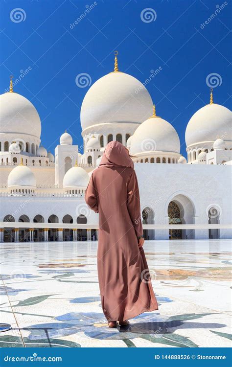 ABU DHABI, UAE - MARCH 11 2019:Woman with Traditional Dress of Brown ...