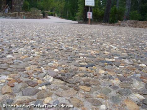 Customize Your New Driveway By Incorporating Embedded River Pebbles | River pebbles, Stone ...