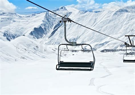 Ski lift chairs on bright winter day | Stock Photo | Colourbox