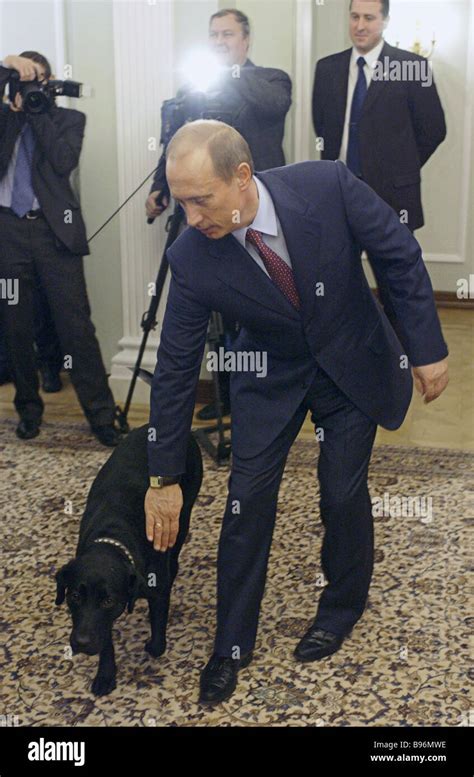 Russian President Vladimir Putin with his dog named Connie at his residence in Novo Ogaryovo ...