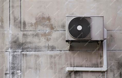 Premium Photo | Old air conditioner condenser on grey wall background ...