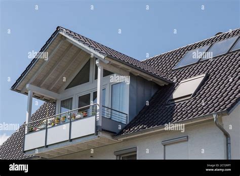 balcony with gable roof on residential building Stock Photo - Alamy